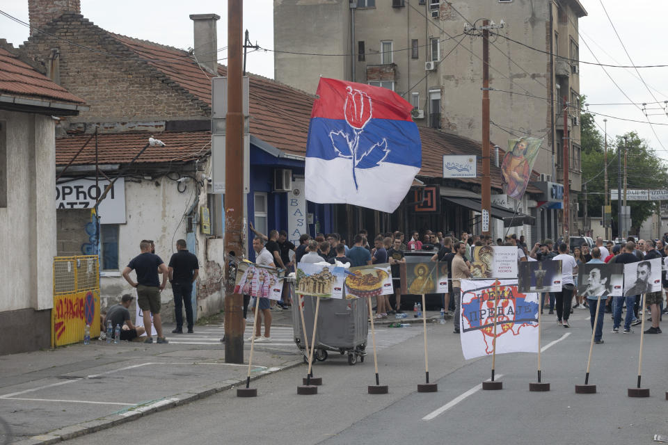 Right-wing extremists gather on a street in central Belgrade, Serbia, Thursday, June 27, 2024. Serbian police on Thursday banned a festival that promotes cultural exchange with Kosovo, in a sign of growing nationalism and government pressure on liberal voices in the Balkan country. The police ban came after several dozen right-wing extremists gathered outside the festival venue, seeking to prevent its holding while waving Serbian flags. (AP Photo/Marko Drobnjakovic)
