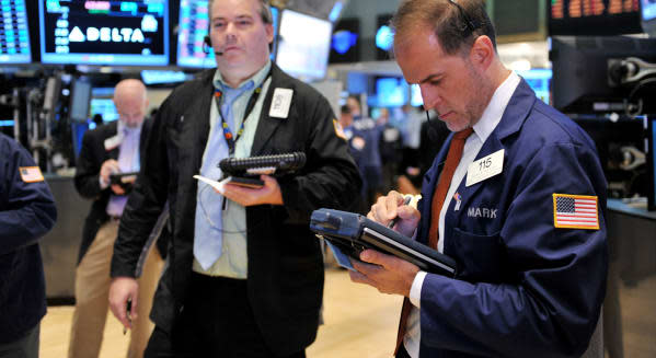 new york stock exchange traders wall street stocks investing earnings economic news