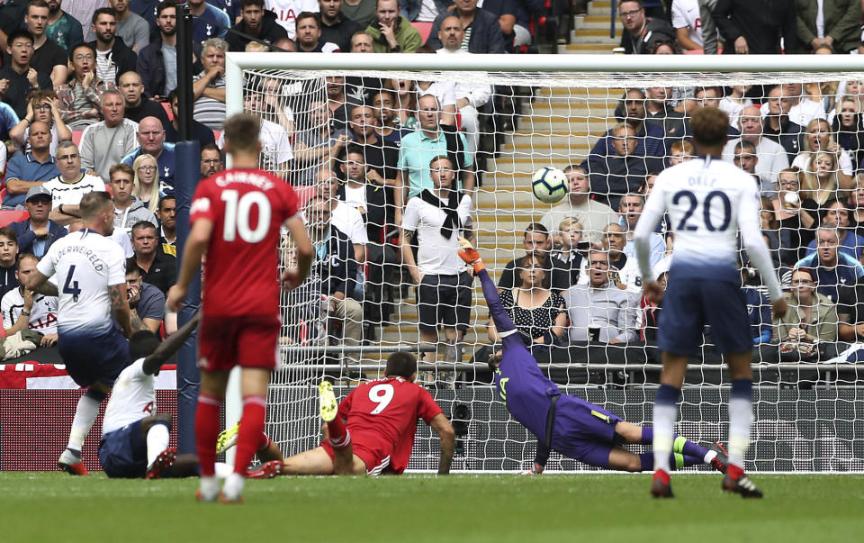 Fulham's Aleksandar Mitrovic, centre, scores his side's first goal of the game during their English Premier League soccer match at Wembley Stadium in London, Saturday Aug. 18, 2018. (Nick Potts/PA via AP)