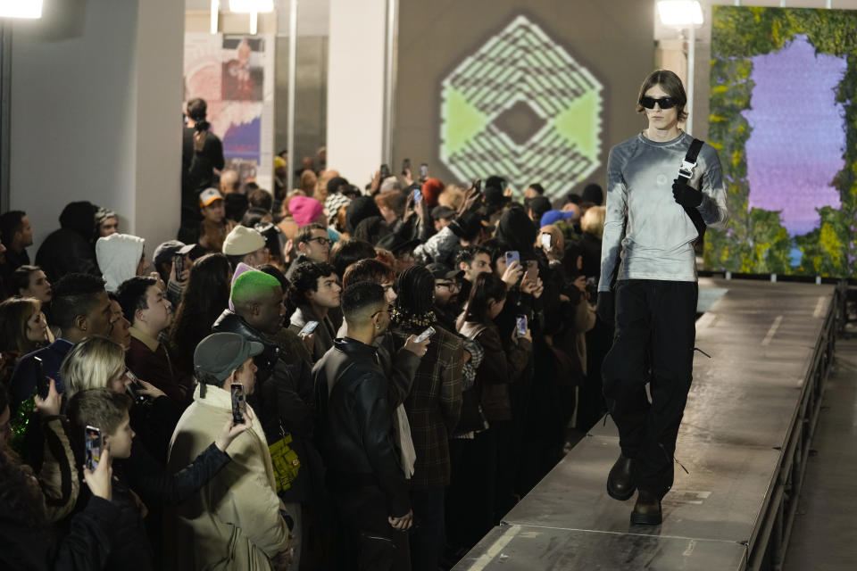 A model wears a creation as part of the ALUX9SM menswear Fall-Winter 2023-24 collection presented in Milan, Italy, Friday, Jan. 13, 2023. (AP Photo/Luca Bruno)