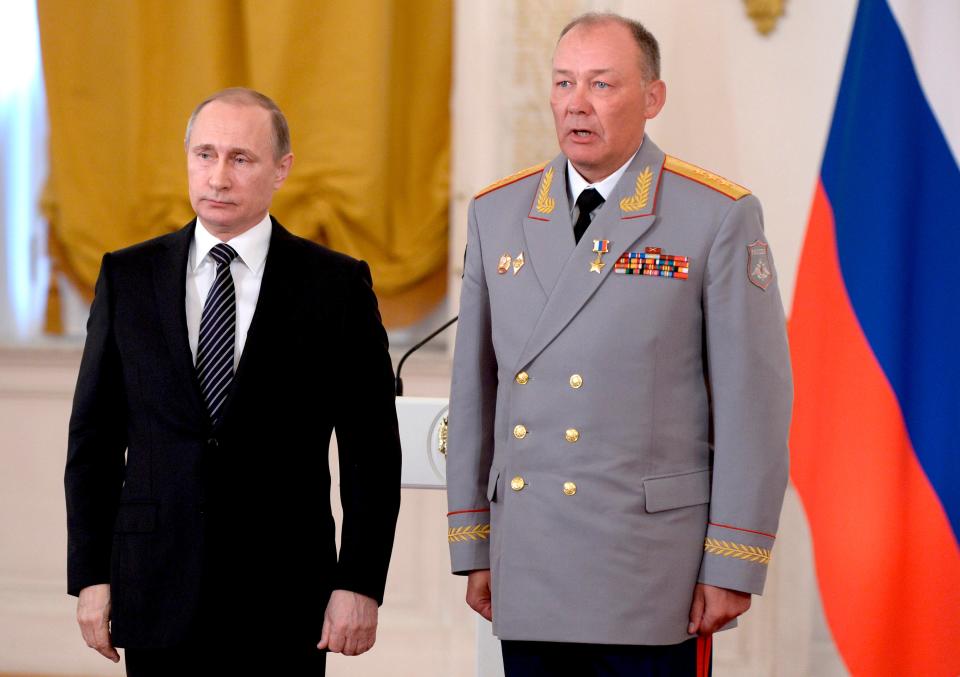 Russian President Vladimir Putin, left, poses with Col. Gen. Alexander Dvornikov, right, during an awarding ceremony in Moscow's Kremlin, Russia on March 17, 2016.