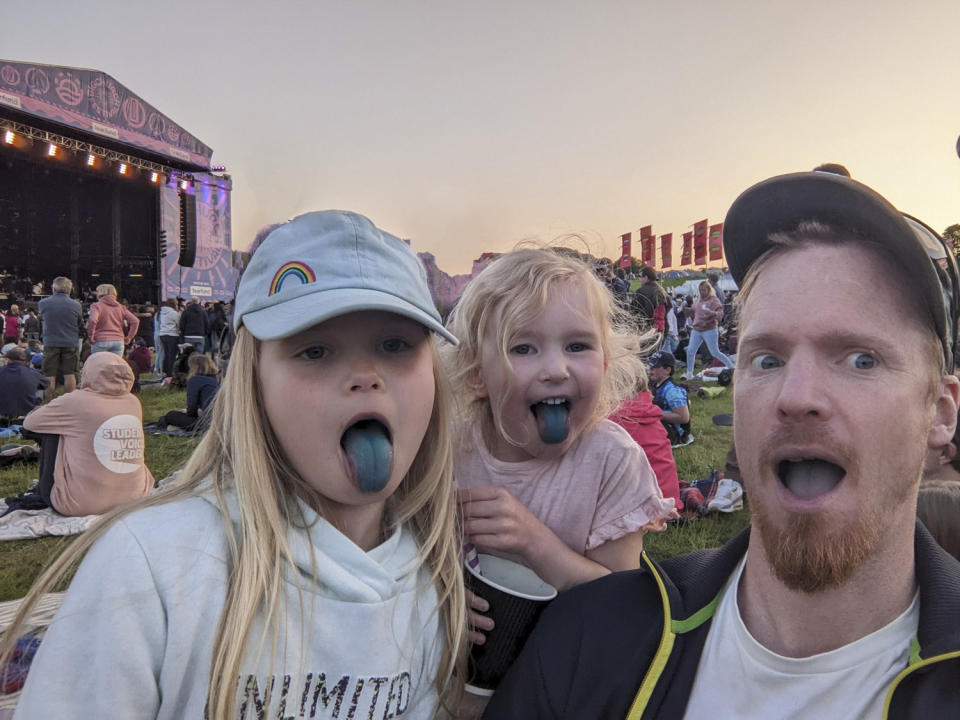 Family portrait at festival with selected Google Magic Eraser suggestions accepted