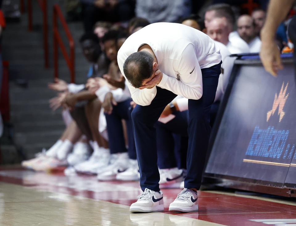 Utah State coach Danny Sprinkle reacts during the first half of the team's NCAA college basketball game against New Mexico on Tuesday, Jan. 16, 2024, in Albuquerque, N.M. (AP Photo/Eric Draper)