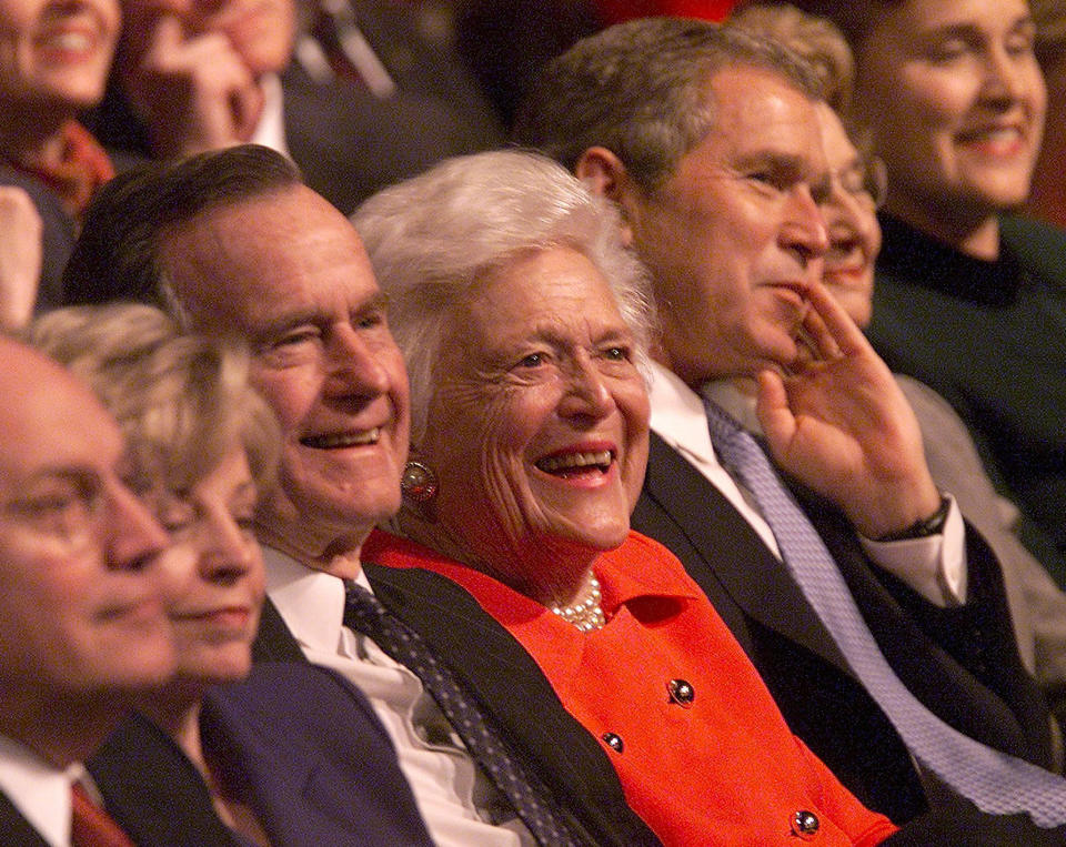 President-elect George W. Bush (right) sits in the audience with (from left) Vice President-elect Dick Cheney, Lynne Cheney, George H.W. Bush and Barbara Bush during the Laura Bush Celebrates America's Authors program on Jan. 19, 2001, in Washington, D.C.