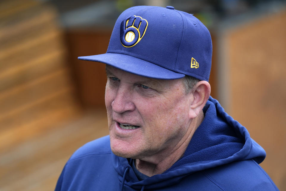 Milwaukee Brewers manager Pat Murphy pauses in the dugout prior to a spring training baseball game against the Arizona Diamondbacks, Sunday, March 24, 2024, in Phoenix. (AP Photo/Ross D. Franklin)