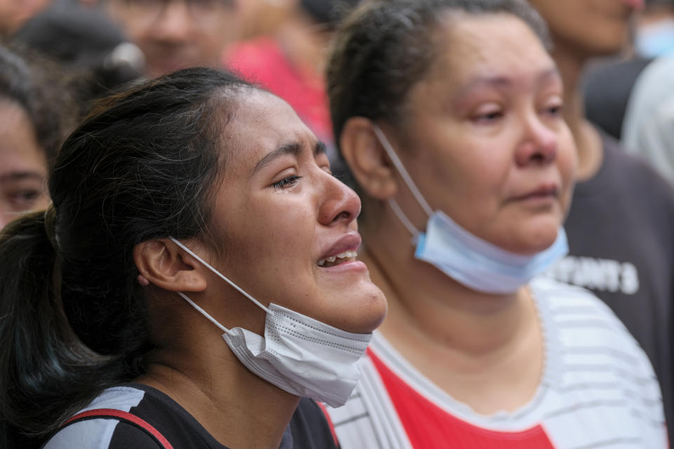 Relatives gather outside the jail after a fatal fire in Tulua, Colombia, Tuesday, June 28, 2022. (AP Photo/Juan Jose Horta)