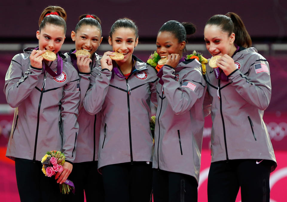 <a href="http://sports.yahoo.com/olympics/gymnastics/mc-kayla-maroney-1134462/" data-ylk="slk:McKayla Maroney;elm:context_link;itc:0;sec:content-canvas" class="link ">McKayla Maroney</a>, <a href="http://sports.yahoo.com/olympics/gymnastics/kyla-ross-1133582/" data-ylk="slk:Kyla Ross;elm:context_link;itc:0;sec:content-canvas" class="link ">Kyla Ross</a>, <a href="http://sports.yahoo.com/olympics/gymnastics/alexandra-raisman-1134192/" data-ylk="slk:Alexandra Raisman;elm:context_link;itc:0;sec:content-canvas" class="link ">Alexandra Raisman</a>, <a href="http://sports.yahoo.com/olympics/gymnastics/gabrielle-douglas-1132742/" data-ylk="slk:Gabrielle Douglas;elm:context_link;itc:0;sec:content-canvas" class="link ">Gabrielle Douglas</a> and <a href="http://sports.yahoo.com/olympics/gymnastics/jordyn-wieber-1131093/" data-ylk="slk:Jordyn Wieber;elm:context_link;itc:0;sec:content-canvas" class="link ">Jordyn Wieber</a> of the United States celebrate after winning the gold medal in the Artistic Gymnastics Women's Team final on Day 4 of the London 2012 Olympic Games at North Greenwich Arena on July 31, 2012 in London, England. (Photo by Jamie Squire/Getty Images)