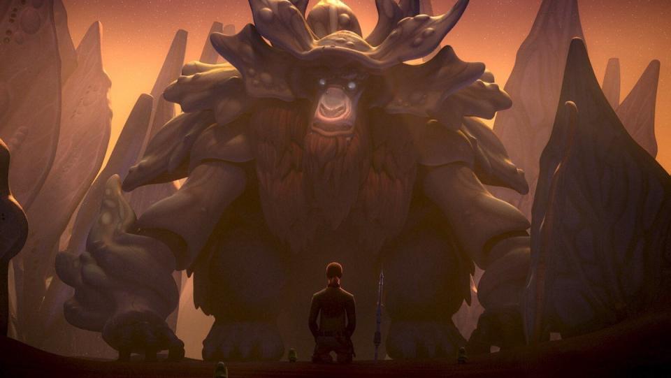 A giant strange moose/bear-like creature named Bendu looms over a kneeling Kanan Jarrus on Star Wars Rebels