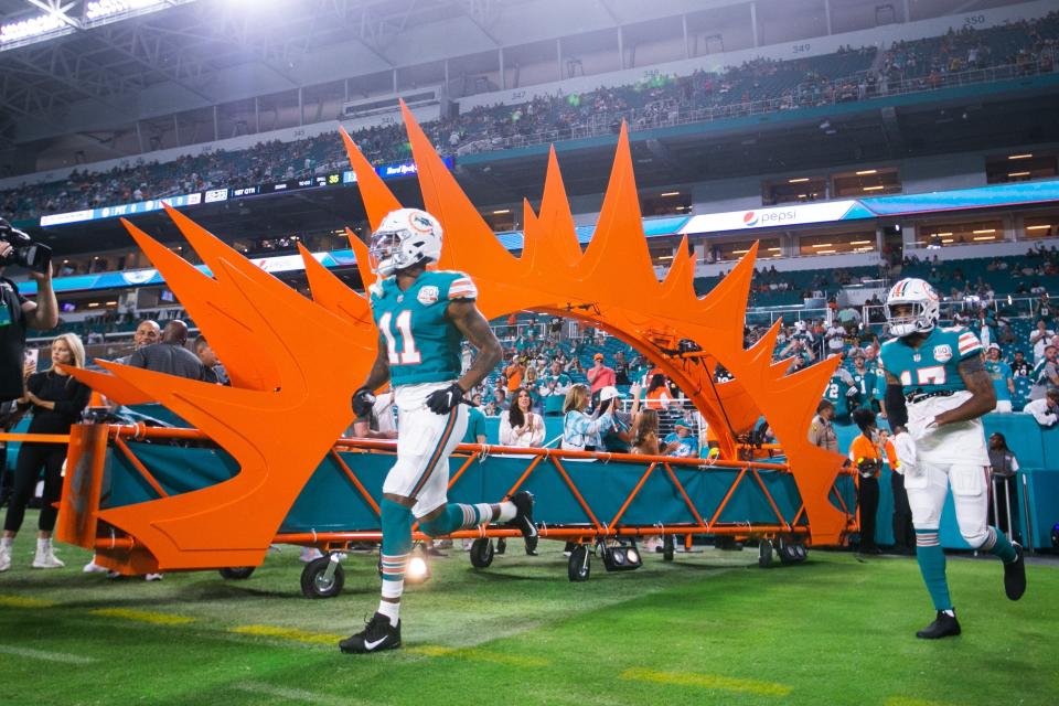 Dolphins receiver Cedrick Wilson Jr. (11) runs onto the field prior to Sunday night's game against the Steelers, but he would end up playing only four snaps during Miami's 16-10 victory.