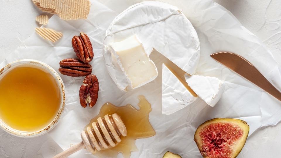 Brie cheese with honey, nuts and fresh fig