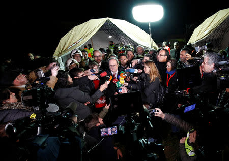 Catalan Regional President Quim Torra speaks to the media at the site of a train crash near Manresa, Spain, February 8, 2019. REUTERS/Albert Gea