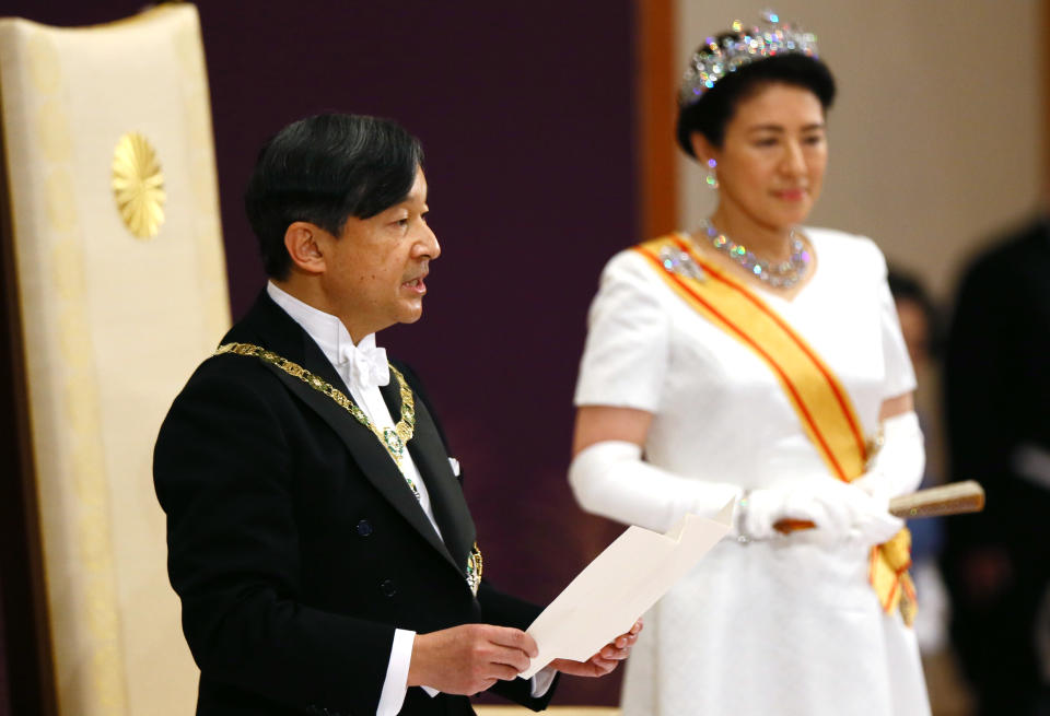 Japan's new Emperor Naruhito, accompanied by new Empress Masako, makes his first address during a ritual after succeeding his father Akihito at Imperial Palace in Tokyo, Wednesday, May 1, 2019.  (Japan Pool via AP)