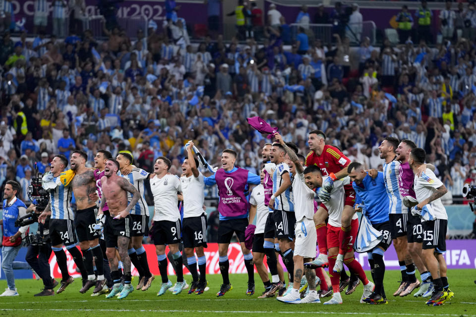 Argentina's players celebrate winning the World Cup round of 16 soccer match between Argentina and Australia at the Ahmad Bin Ali Stadium in Doha, Qatar, Saturday, Dec. 3, 2022. (AP Photo/Petr David Josek)