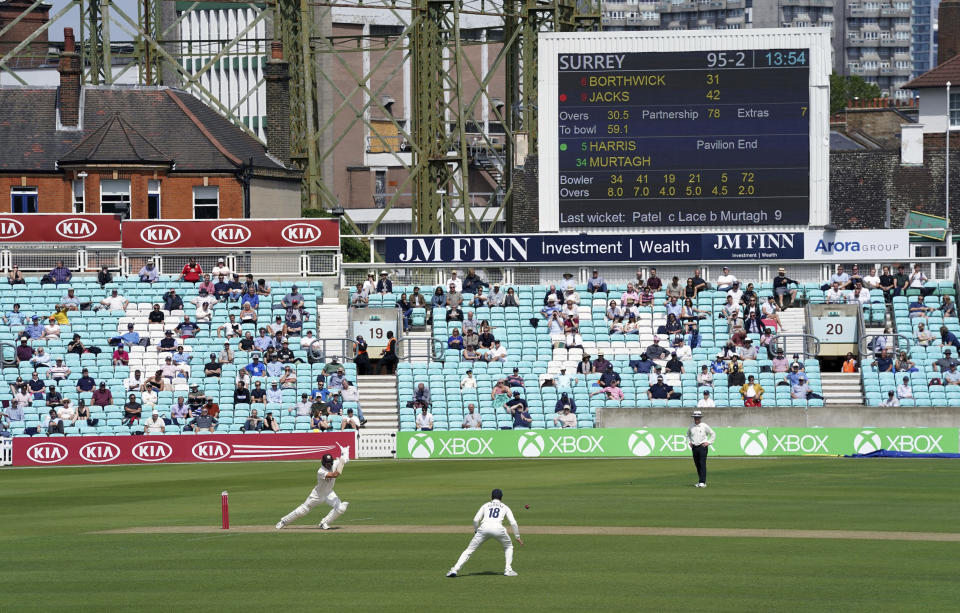 Surrey's Will Jacks bats during the friendly cricket match at the Oval, London, Sunday, July 26, 2020. Spectators have been allowed into a sporting event in England for the first time since March when coronavirus prevention measures were tested at a cricket match between Surrey and Middlesex at The Oval ahead of a planned wider reopening of stadiums in October. Alternate rows were used across two stands and advisory signs were on show for the friendly match being watched by 1,000 people. (John Walton/PA via AP)