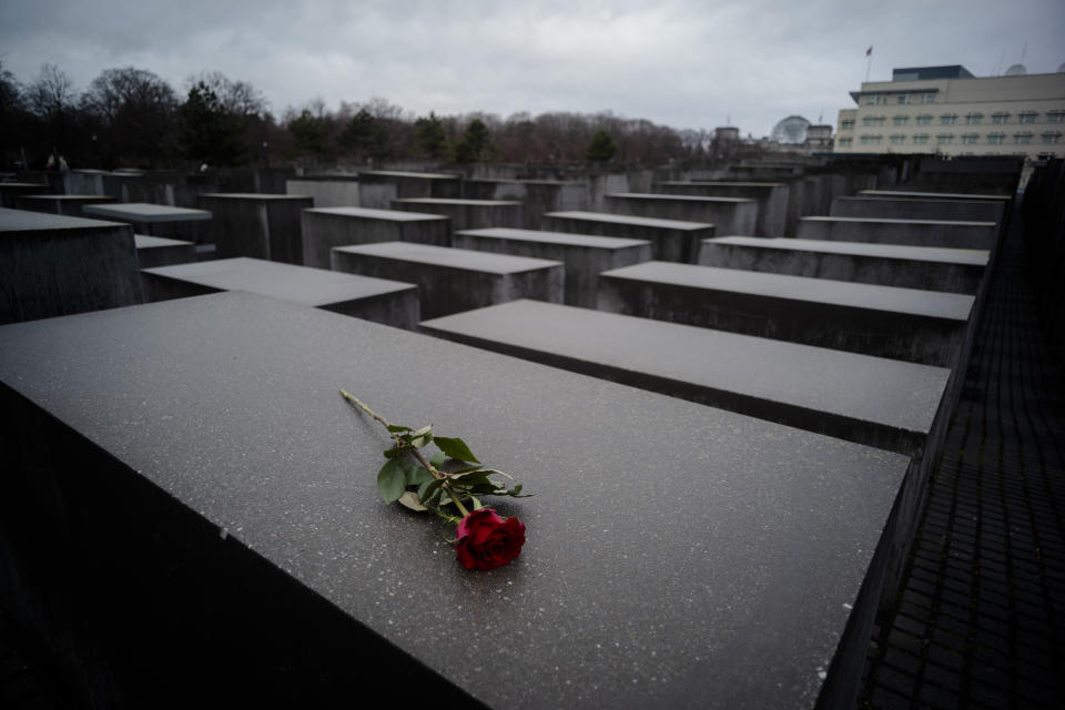 A red rose lies on a slab of the Holocaust Memorial to commemorate the victims of the Nazis in Berlin, Sunday, Jan. 27, 2019. The International Holocaust Remembrance Day marks the liberation of the Auschwitz Nazi death camp on Jan. 27, 1945. (AP Photo/Markus Schreiber)