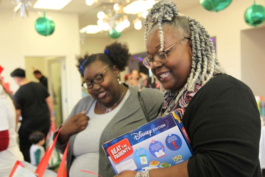 La’Delegant Hartsfield, left, and Stephanie Brodie, right, shop at The Toy Store, a free-referral based toy store, Friday, Dec. 8, 2023, in Nashville, Tenn. The facility is co-founded by Brad Paisley and Kimberly Williams-Paisley. The couple also started The Store, a free-referral based grocery store they opened in partnership with Belmont University in March 2020. (AP Photo/Kristin M. Hall)