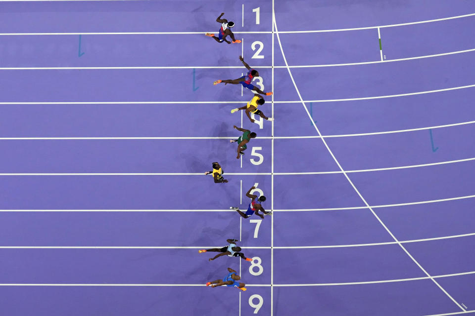 Noah Lyles of the United States wins the men's 100 meters final in lane seven during the 2024 Summer Olympics, Sunday, Aug. 4, 2024, in Saint-Denis, France. (AP Photo/David J. Phillip)