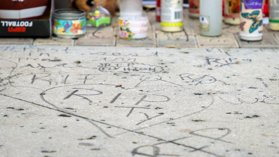 People including family gathered at a vigil outside Orlando FreeFall Monday to honor 14-year-old Tyre Sampson, who fell from the ride and died last week.