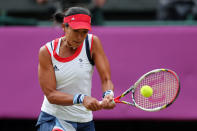 LONDON, ENGLAND - JULY 28: Anne Keothavong of Great Britain returns a shot against Caroline Wozniacki of Denmark during their Women's Singles Tennis match on Day 1 of the London 2012 Olympic Games at the All England Lawn Tennis and Croquet Club in Wimbledon on July 28, 2012 in London, England. (Photo by Clive Brunskill/Getty Images)