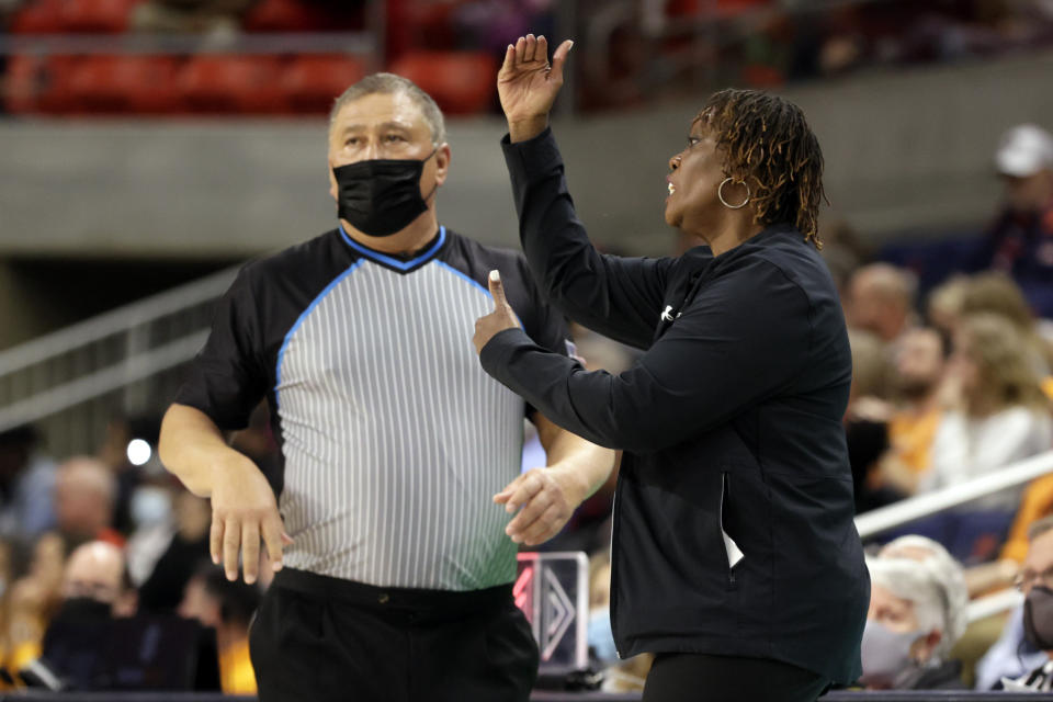 Auburn head coach Johnnie Harris, right, reacts to a call during the second half of an NCAA college basketball game against Tennessee, Thursday, Jan. 27, 2022, in Auburn, Ala. (AP Photo/Butch Dill)