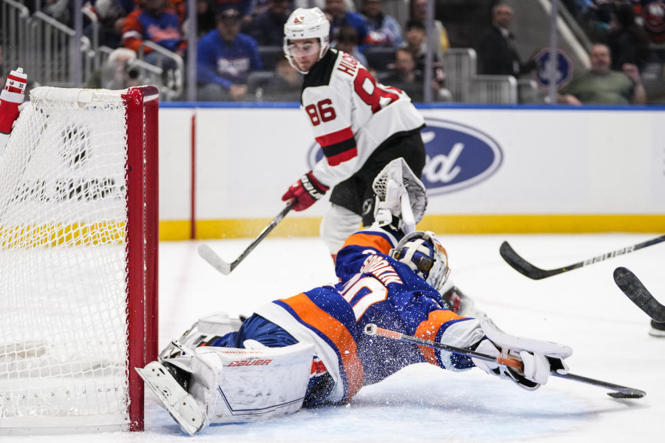 New York Islanders goaltender Ilya Sorokin (30) stops a shot on goal by New Jersey Devils' Jack Hughes (86) during the first period of an NHL hockey game Friday, Oct. 20, 2023, in Elmont, N.Y. (AP Photo/Frank Franklin II)