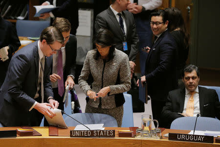 United States ambassador to the United Nations (UN) Nikki Haley speaks to members of her staff before a meeting of the UN Security Council to discuss a North Korean missile launch at UN headquarters in New York, U.S., November 29, 2017. REUTERS/Lucas Jackson