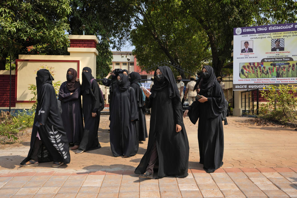 FILE- Muslim students leave Mahatma Gandhi Memorial college after they were denied entry into the campus for wearing the burqa in Udupi, Karnataka state, India, on Feb. 24, 2022. (AP Photo/Aijaz Rahi, File)