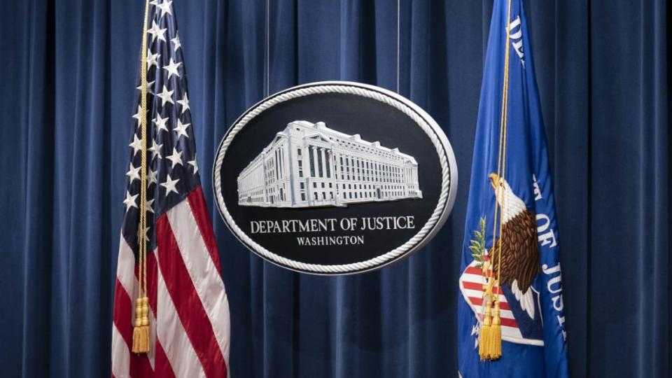 A sign for the U.S. Department of Justice is shown before officials hold a press conference on Jan. 12, 2021 to give an update on the investigation into the Capitol Hill riots in Washington, D.C. A recent report reveals that deaths in custody go underreported to the Department of Justice despite a law saigned in 2014 that requires law enforcement agencies to do so. (Photo: Sarah Silbiger-Pool/Getty Images)