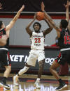 Virginia Tech's Tyrece Radford looks to pass while guarded by VMI defenders during the second half of an NCAA college basketball game, Thursday, Dec. 3, 2020 in Blacksburg, Va. (Matt Gentry/The Roanoke Times via AP, Pool)