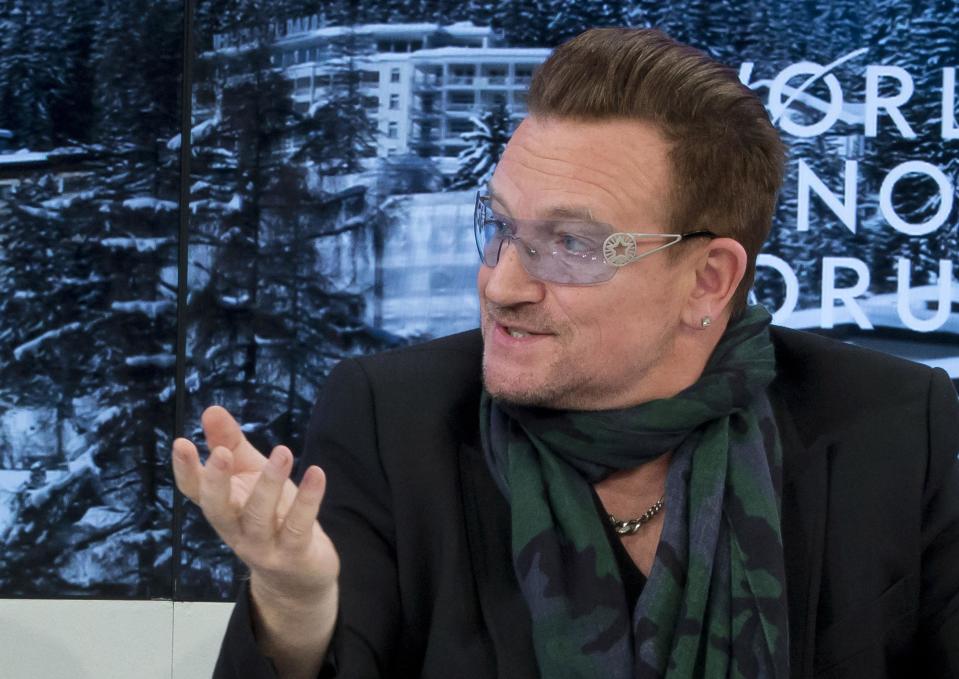 Rock star Bono speaks during a panel discussion "The Post-2015 Goals: Inspiring a New Generation to Act", the fifth annual Associated Press debate, at the World Economic Forum in Davos, Switzerland, Friday, Jan. 24, 2014. (AP Photo/Michel Euler)