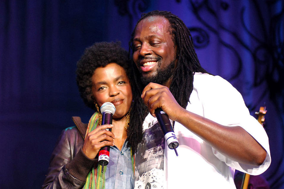 Lauryn and Wyclef hugging onstage