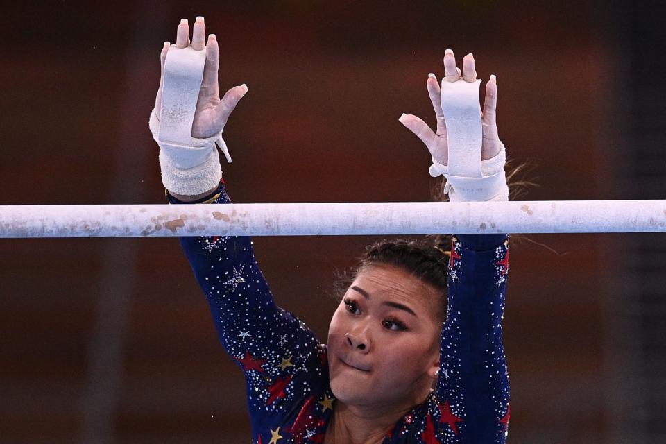 <p>USA's Grace Mc Callum competes in the uneven bars event of the artistic gymnastics women's qualification during the Tokyo 2020 Olympic Games at the Ariake Gymnastics Centre in Tokyo on July 25, 2021. (Photo by Martin BUREAU / AFP) (Photo by MARTIN BUREAU/AFP via Getty Images)</p> 