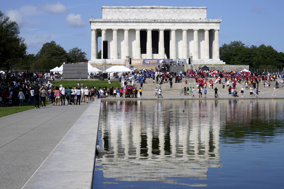 People attend the 60th anniversary of the March on Washington at the Lincoln Memorial, Saturday, Aug. 26, 2023, in Washington. The Rev. Al Sharpton, Martin Luther King, III, and Andrea Waters King have brought together 60 national organizations across racial, cultural, and generational lines as partners for the anniversary. (AP Photo/Jacquelyn Martin)