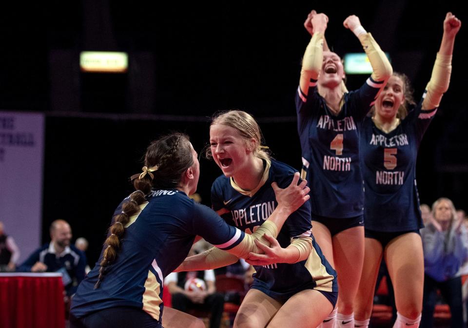 Appleton North's Ella Demetrician (8), Teegan Charapata (10), Emerson Van Lannen (4) and Maggie Hahnke (5) celebrate during the WIAA Division 1 state quarterfinal against Kettle Moraine on Thursday at the Resch Center in Ashwaubenon.