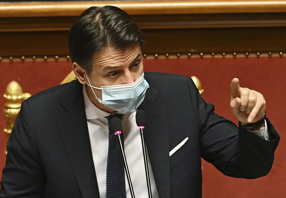 Premier Giuseppe Conte delivers his speech at the Senate, in Rome, Tuesday, Jan. 19, 2021. Conte fights for his political life with an address aimed at shoring up support for his government, which has come under fire from former Premier Matteo Renzi's tiny but key Italia Viva (Italy Alive) party over plans to relaunch the pandemic-ravaged economy. (Andreas Solaro/Pool via AP)