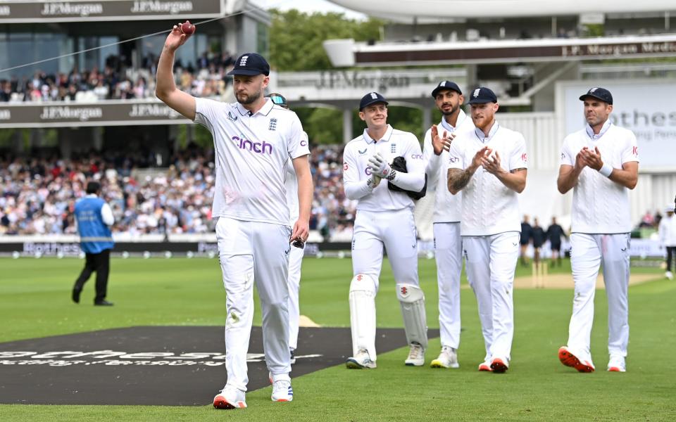 Gus Atkinson walks off with the ball after taking seven wickets