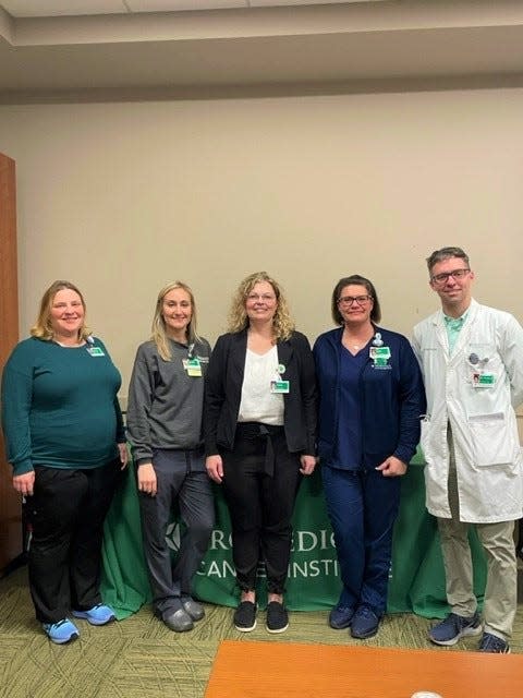 ProMedica Cancer Institute Radiation Oncology staff include (from left) Andrea Herrick, medical physicist; Natalie Gibson, radiation oncology supervisor; Anita Stolaruk, associate vice president of radiation oncology; Erin Pawlowicz, patient care supervisor; and Dr. Jeffrey Forquer, radiation oncologist.