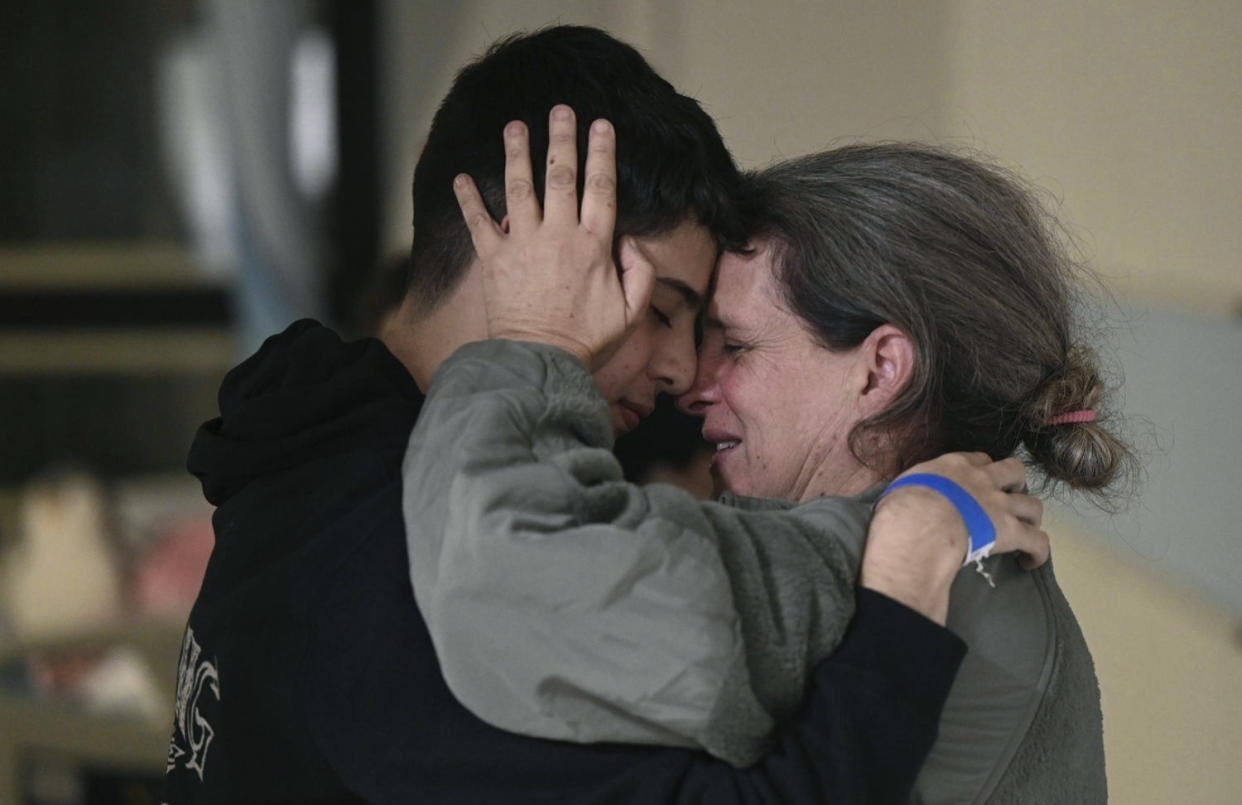 Sharon Hertzman, right, hugging a relative as they reunite at Sheba Medical Center in Ramat Gan, Israel, on Nov. 25. (Haim Zach / AP)