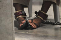 GUANTANAMO BAY NAVAL BASE, CUBA - APRIL 27: (EDITORS NOTE: Image has been reviewed by the U.S. Military prior to transmission) A Guantanamo detainee's feet are shackled to the floor as he attends a "Life Skills" class inside the Camp 6 high-security detention facility April 27, 2010 at Guantanamo Bay U.S. Naval Base, Cuba. Today, a military tribunal began hearings on whether Omar Khadr, a Candian by birth who was 15 at the time of his capture in Afghanistan, made statements to interrogators under duress, which would render them them inadmissable in the first military tribunal to be held under the Obama Administration. (Photo by Michelle Shephard-Pool/Getty Images)