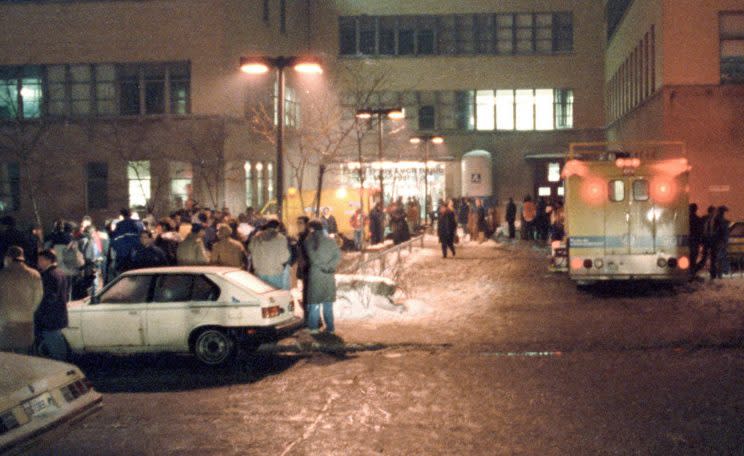 Paramedics work outside the École Polytechnique after gunman Marc Lépine opened fire at the school in Montreal on Dec. 6, 1989. Photo from The Canadian Press