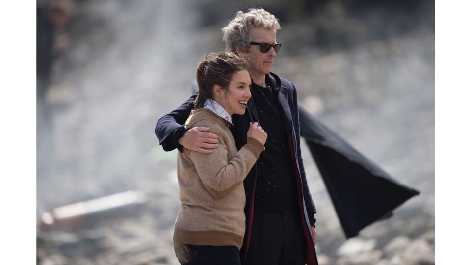 Peter Capaldi with his arm around Ingrid Oliver during filming of Doctor Who