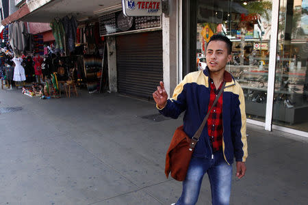 Honduran migrant Ariel, 19, who is waiting for his court hearing for asylum seekers returned to Mexico to wait out their legal proceedings under a new policy change by the U.S. government, is pictured after an interview with Reuters in Tijuana, Mexico March 18, 2019. Picture taken March 18, 2019. REUTERS/Jorge Duenes