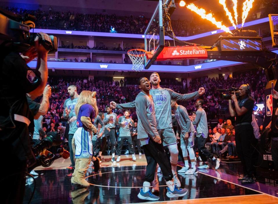 Sacramento Kings guard De’Aaron Fox and forward Domantas Sabonis bump chests during the pregame introduction at Golden 1 Center on Thursday, March 9, 2023. Paul Kitagaki Jr./pkitagaki@sacbee.com