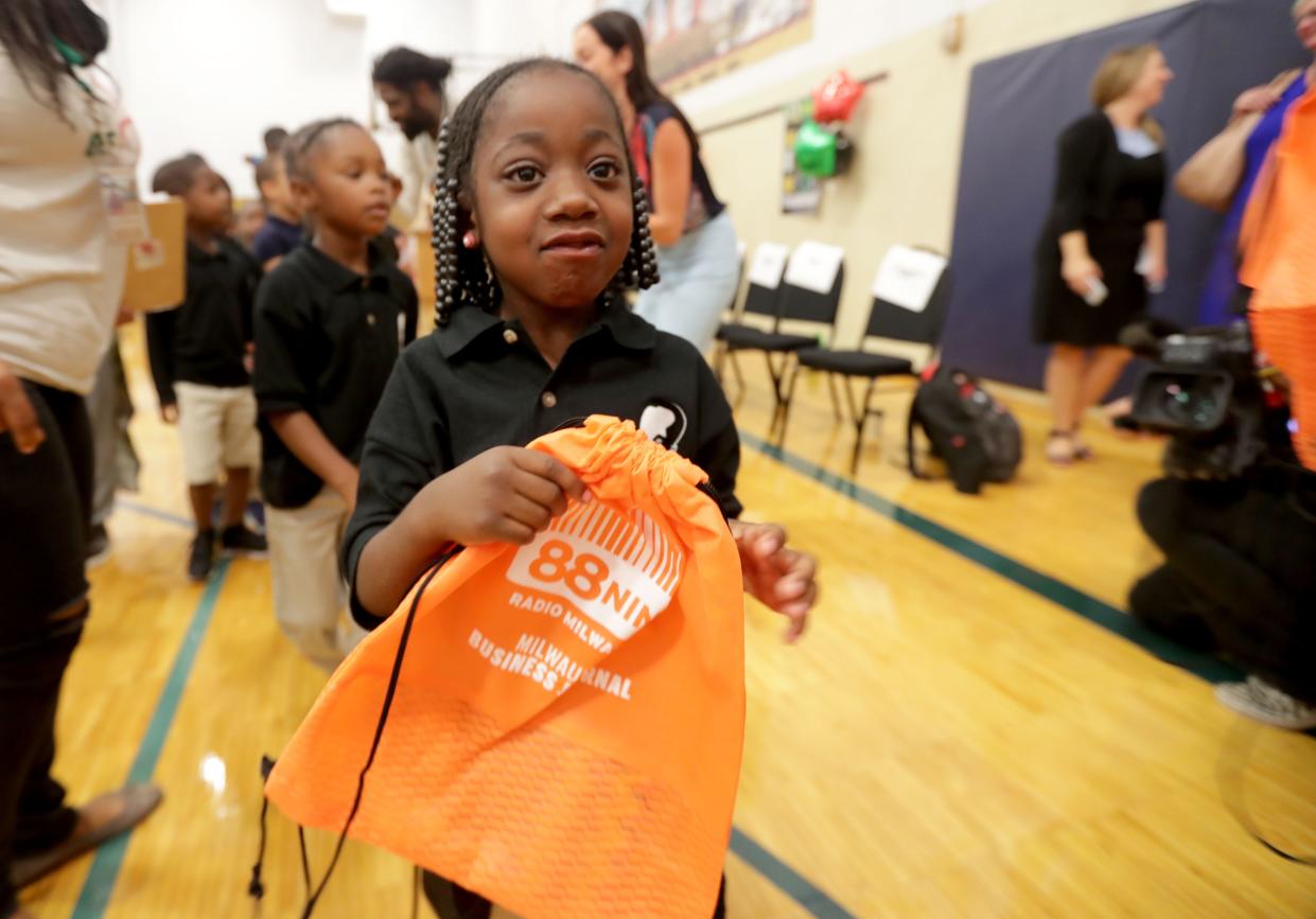 A'Vaehteyana Wade, a Dr. Martin Luther King Jr. Elementary School student, gets her backpack. Milwaukee Public Schools students received backpacks that they'll fill with school supplies donated by area residents through the third annual No Empty Backpacks School Supplies Drive at the school Wednesday. Students at a school assembly received more than 7,000 items, including 2,500 crayons and 1,600 pencils. Area residents dropped off items in July and August at 88Nine Radio Milwaukee, other area businesses and more than 50 other community drop-off locations.