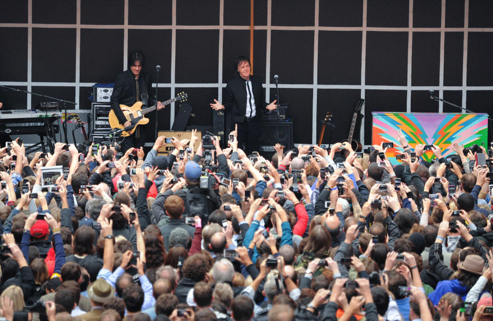 Paul McCartney and his band give a surprise pop up concert in Times Square on Thursday, Oct. 10, 2013 in New York. McCartney will release his new album called "New" on October 15th. (Photo by Evan Agostini/Invision/AP)