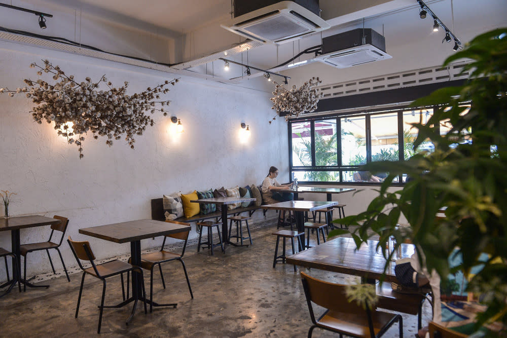 A diner is seen at a cafe in Bangsar, August 25, 2021. — Picture by Miera Zulyana