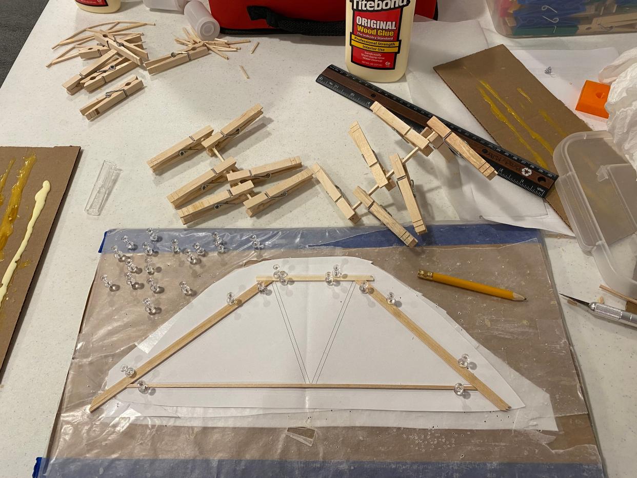 Brady Miller's is working on his bridge construction for the upcoming International Bridge Building Competition Saturday, Kent State University Tuscarawas.