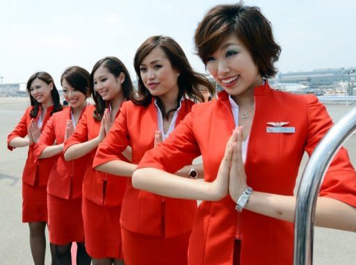 Air Asia Japan's cabin attendants at Narita International Airport on July 19, 2012. All Air Asia Japan staff will become Vanilla Air staff