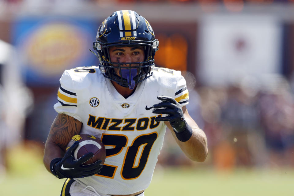 Missouri running back Cody Schrader carries the ball against Auburn during the second half of an NCAA college football game, Saturday, Sept. 24, 2022 in Auburn, Ala. (AP Photo/Butch Dill)