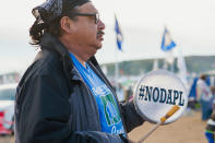 <p>A protester demonstrates against the Dakota Access oil pipeline near the Standing Rock Sioux reservation in Cannon Ball, N.D., on Sept. 9, 2016. (Photo: Andrew Cullen/Reuters) </p>